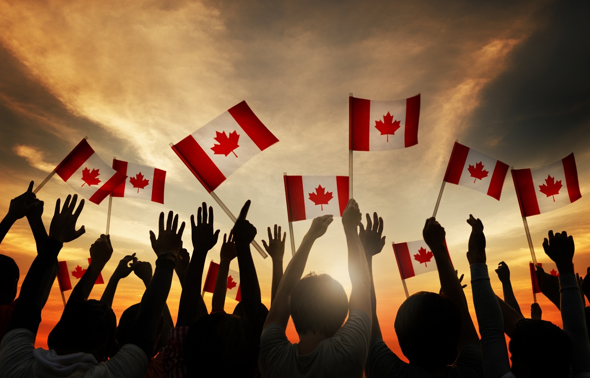 Group,Of,People,Waving,Canadian,Flag